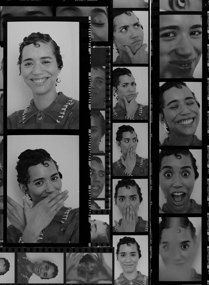 Black and white contact sheet featuring a young woman with short curly hair, wearing a collared shirt, and displaying various facial expressions.