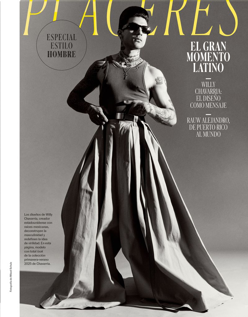 Model wearing dark sunglasses, tank top, and wide pleated trousers against a grey studio backdrop for S Moda for El Pais.