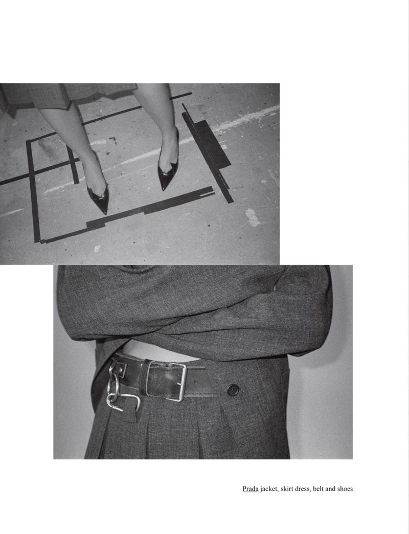 Monochrome fashion shot of woman's legs in heels on marked floor and a woman wearing a belt, jacket and skirt.