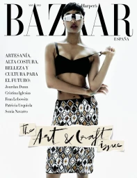 Jourdan Dunn wearing a black bralette, futuristic visor sunglasses, and a geometric skirt on the cover of Harper's Bazaar España.