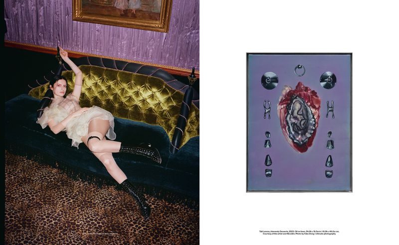 Woman in a light dress poses on a green velvet couch with an art piece featuring a heart and fetus on a lilac background.
