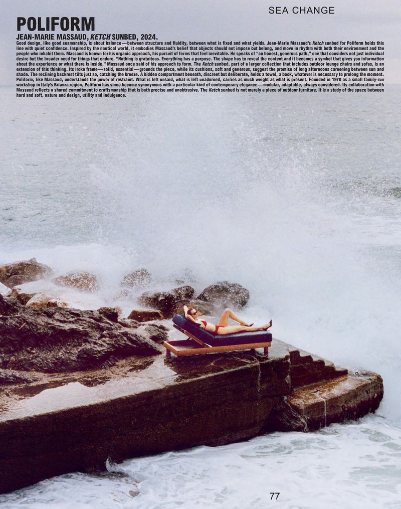 Woman in red swimsuit lounges on outdoor chaise lounge by ocean waves crashing on rocks, Poliform advertisement, Ketcun Sunbed.
