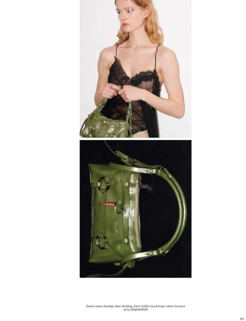 Fashion shot featuring a woman in a black lace top holding a green leather handbag with metal ring details against a white backdrop.