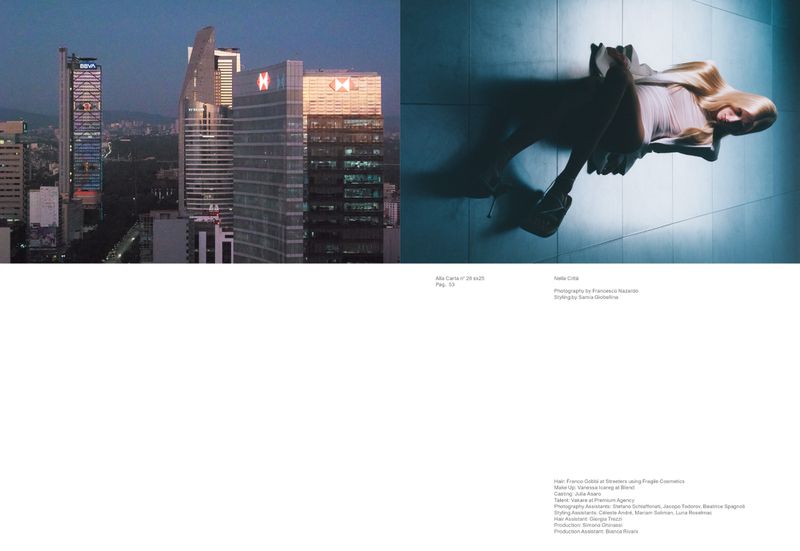 Fashion editorial image with a blonde woman in a light pink dress lying on a tiled floor contrasted with a cityscape view of skyscrapers at dusk.