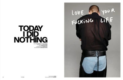 Spread showing editorial text on left and a man from behind wearing a black shirt and leather chaps against a grey background.