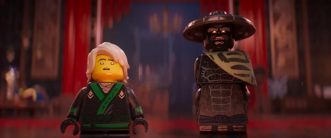 Close-up of two Lego figures, one with white hair in a black and green outfit, and the other with a hat and brown detailed outfit.