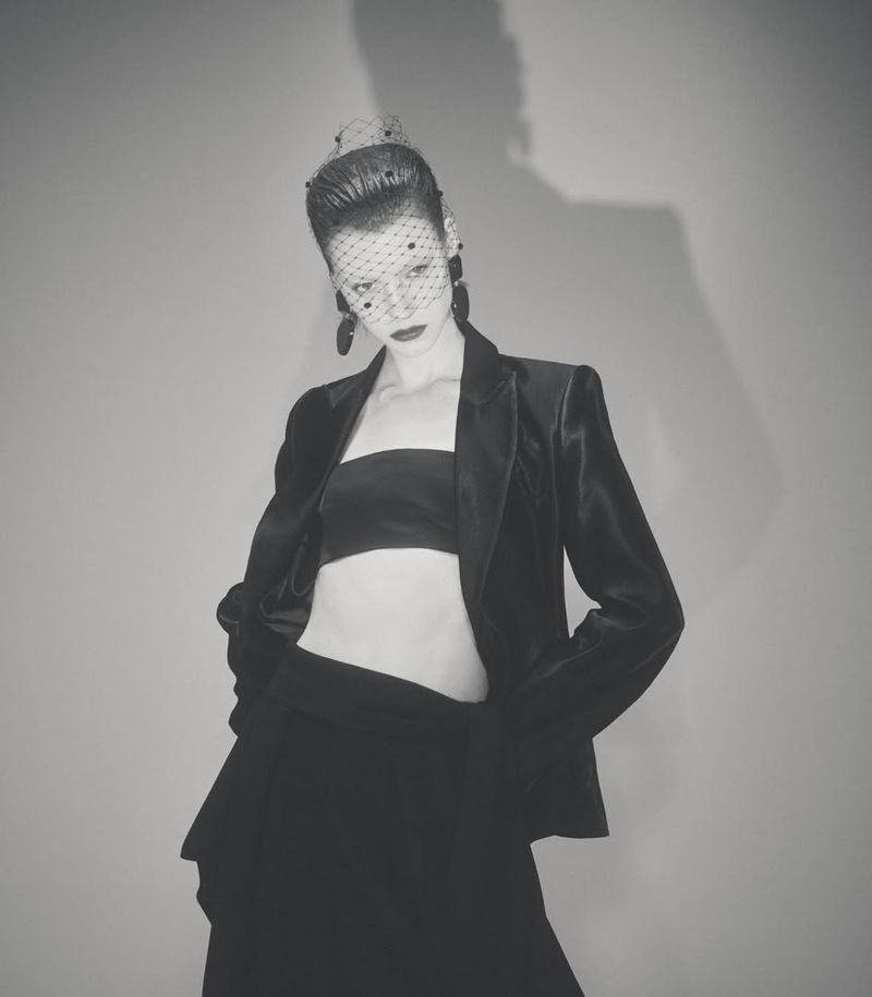 Model Dana Smith wearing a black velvet blazer and veil in High Voltage for D Repubblica, photographed by Casper Sejersen.