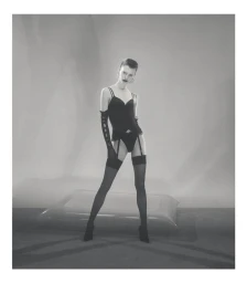 Model Dana Smith wearing black lingerie and stockings in a studio shot for D Repubblica, photographed by Casper Sejersen.