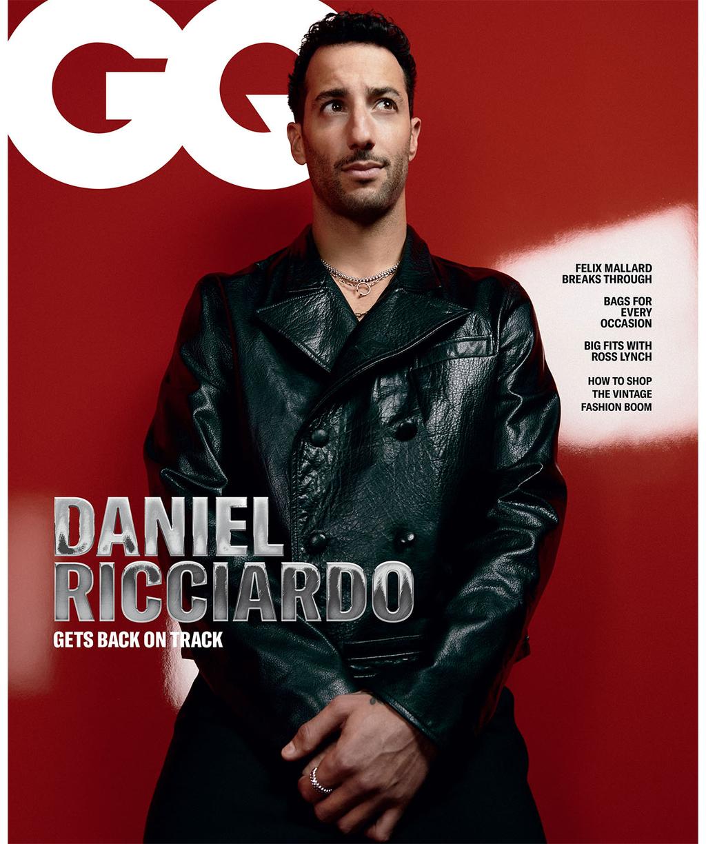 GQ magazine cover featuring Daniel Ricciardo in a shiny black jacket against a red background, with magazine text and layout elements.