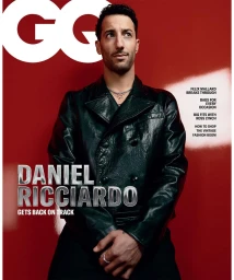Daniel Ricciardo wearing a dark leather jacket against a red background for GQ Australia magazine.