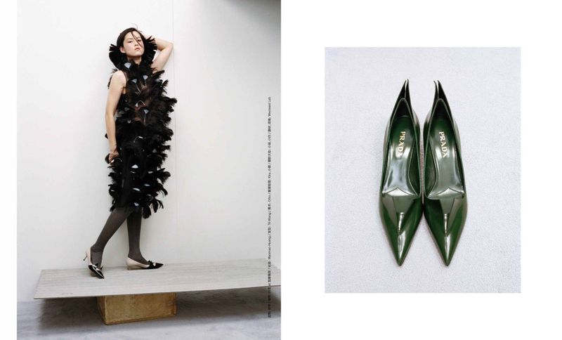 Editorial fashion shot featuring an adult female model in a black feather dress next to a pair of green PRADA high heel shoes.