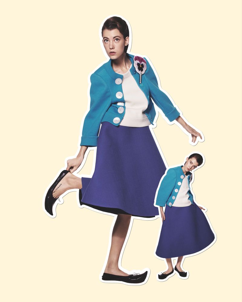 Fashion editorial shot of a woman in a blue jacket and purple skirt, with a smaller image of her in the bottom right corner.