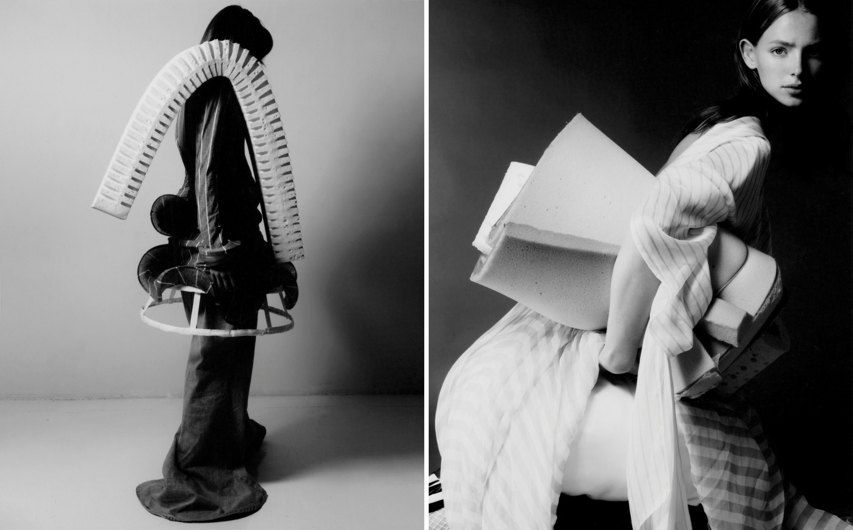 Monochrome fashion photography showcasing a female model in an artistic outfit with geometric forms, against a minimalist background.