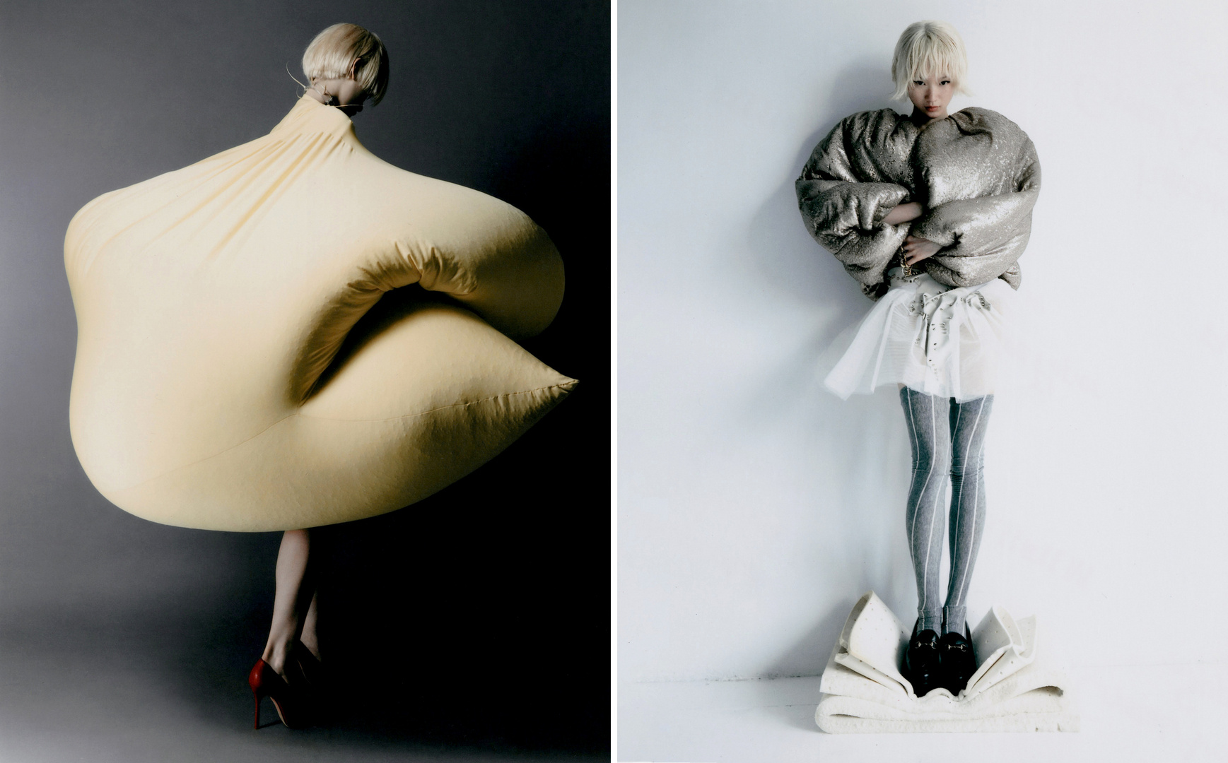Fashion editorial shot of two women wearing avant-garde clothing, one in a yellow padded body suit, the other in a silver puffy jacket.
