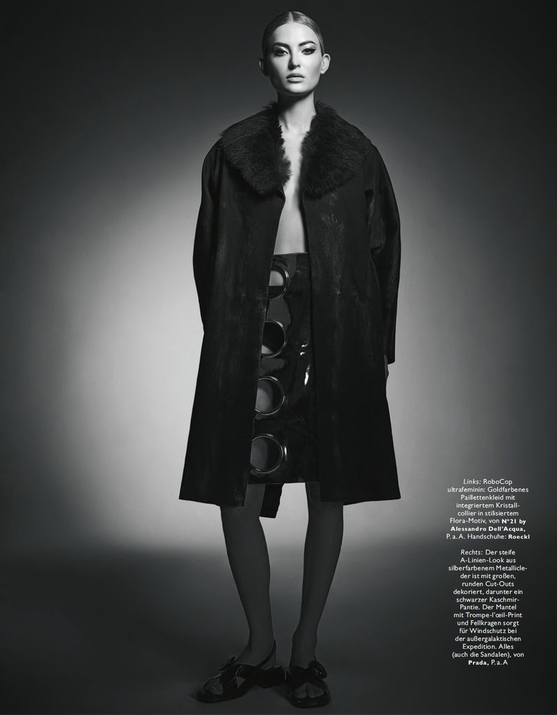 Model Emma StSalhammar in a dark fur-collared coat against a seamless background for Madame Germany.