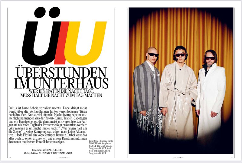 Editorial fashion shot of three men in stylish coats and sunglasses against a golden curtain backdrop, part of a magazine spread.