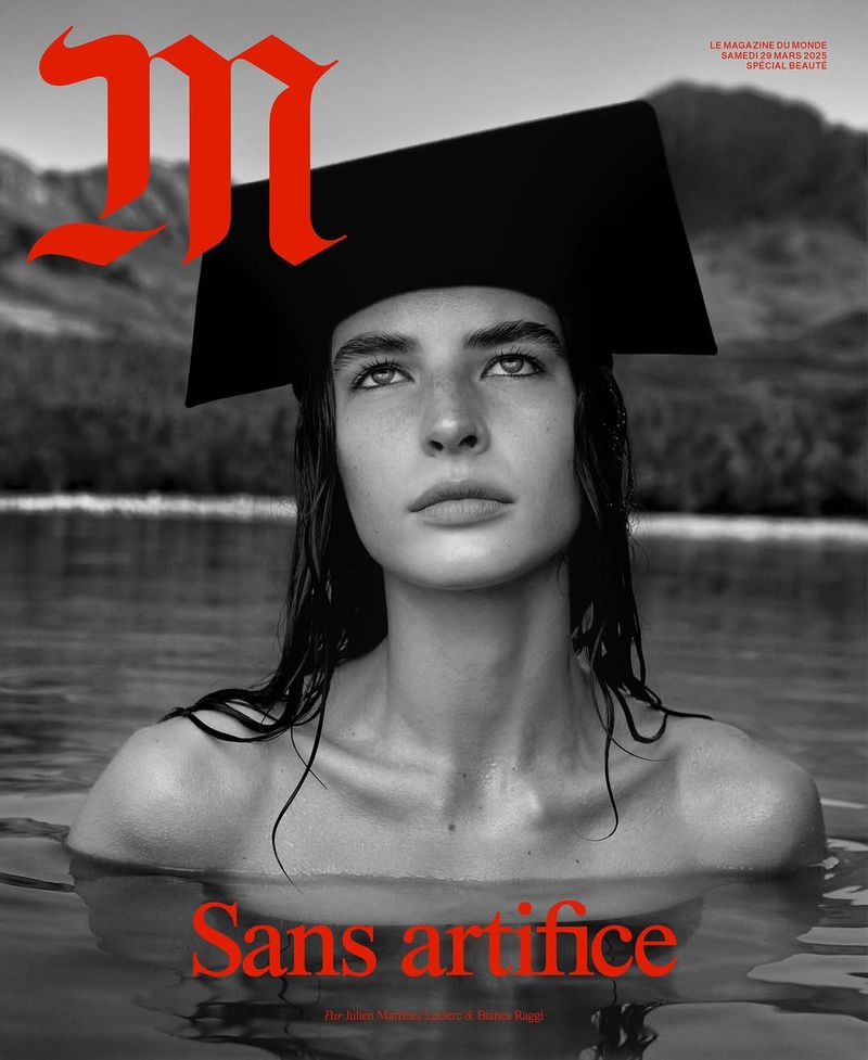 Magazine cover featuring a woman in water wearing a black square graduation cap, with a blurred monochrome mountain and lake background.