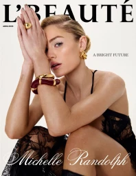 Magazine cover portrait featuring Michelle Randolph with hands clasped near face wearing gold jewelry and black lace apparel.