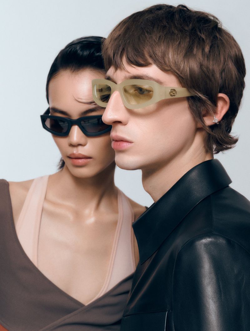 Two models wearing designer sunglasses against a clean white backdrop for Cosmopolitan Germany by Tobias Wahl