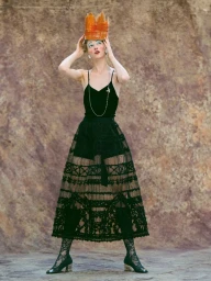 Model Lera Koss wearing a black lace skirt, tank top, and crown, photographed by Thanassis Krikis for Madame Figaro Greece.