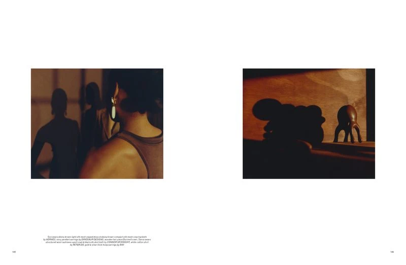 Editorial fashion shot of three adult women in a photo studio wearing tank tops and earrings, illuminated by warm, diffused lighting.
