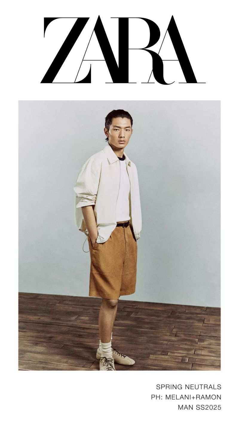 A stylish man in a light jacket and brown shorts poses against a light background with 'ZARA' logo. A fashion forward spring look.
