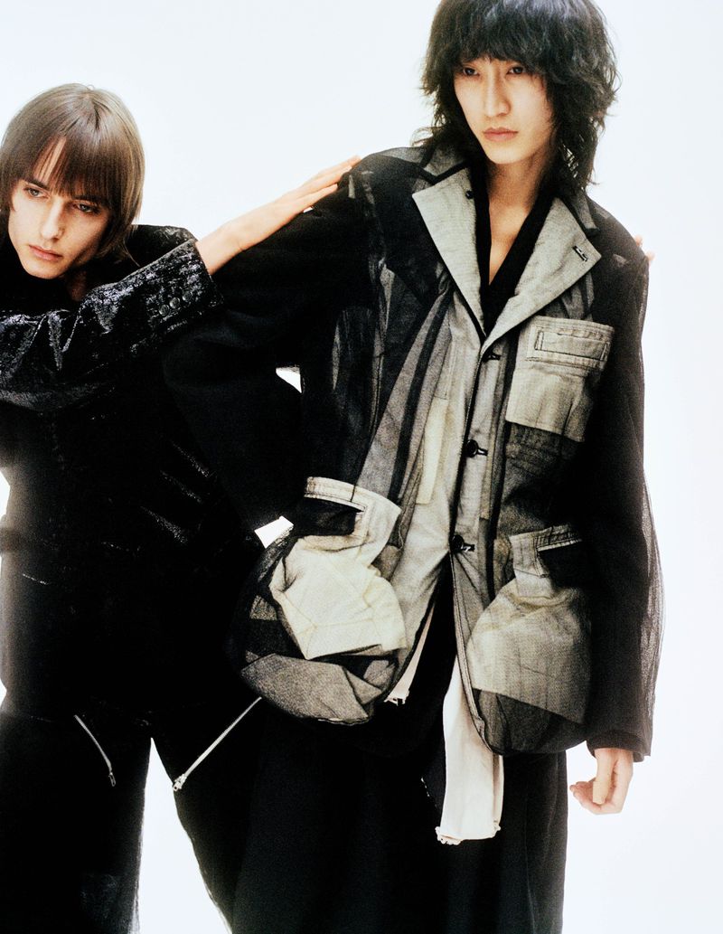Two models wearing textured dark jackets against a seamless white studio background for the Parade project by Crosscurrent.