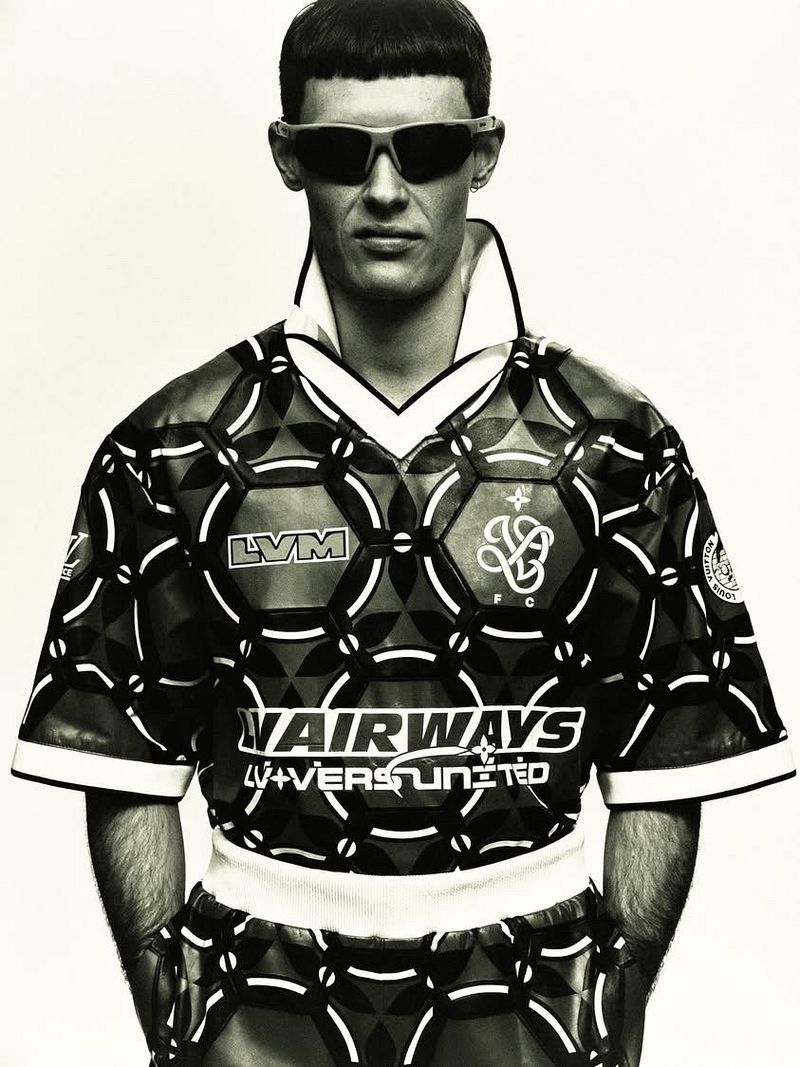 Model Connor Newall wearing patterned athletic top and sunglasses against a light background for 10 Men Magazine