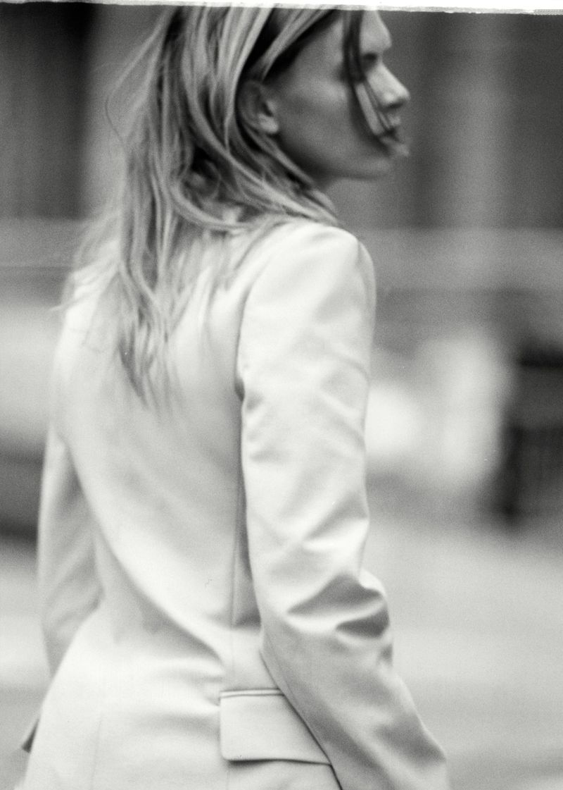 Model Sara Eirud wearing a tailored blazer outdoors for Puss Puss Magazine
