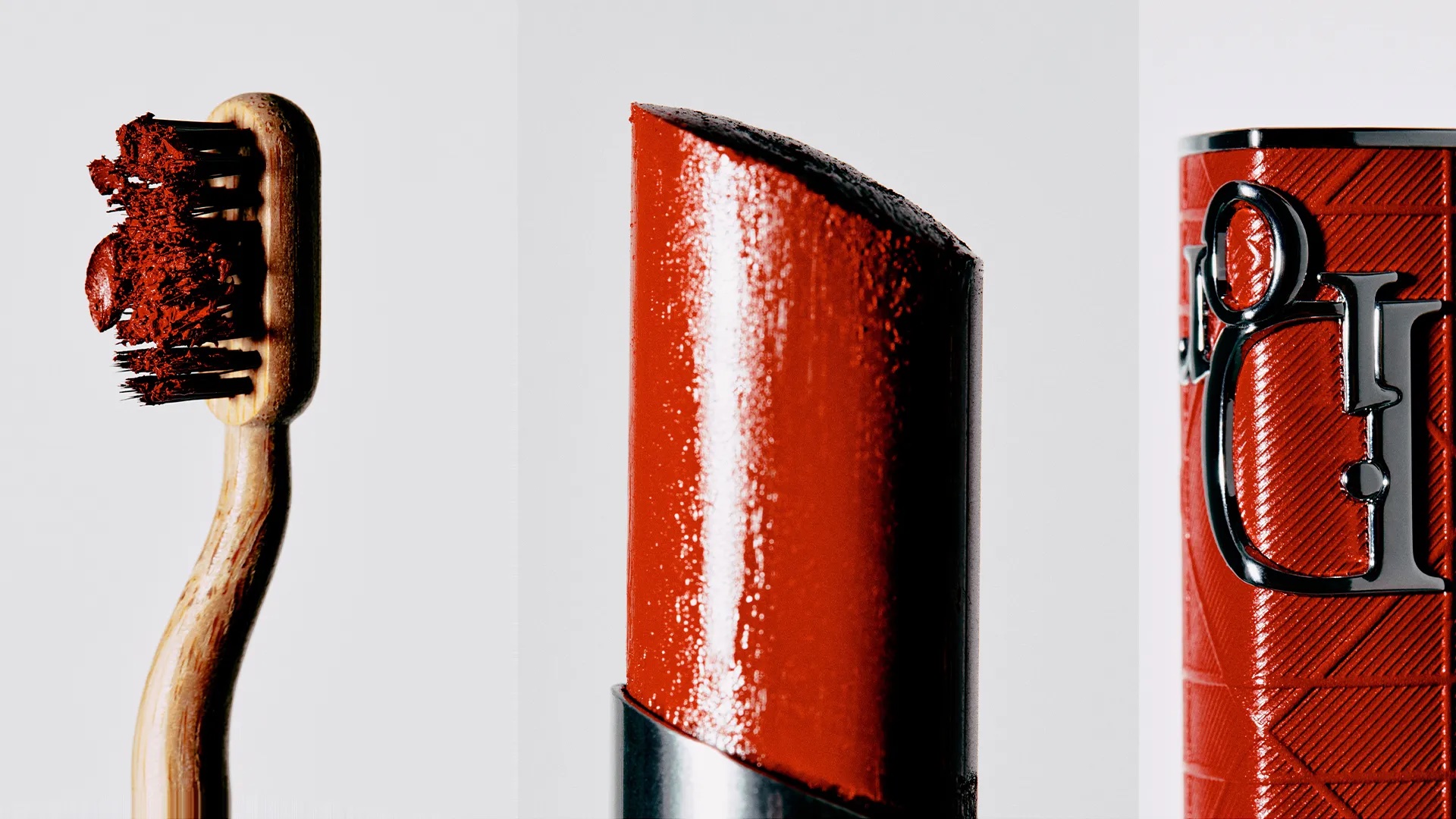 Close-up studio shot of a toothbrush with red toothpaste and a red lipstick bullet and tube on a white background.