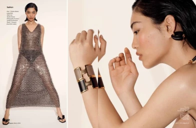 Model Cheng Xin in a sheer metallic mesh dress and statement cuffs for Hashtag Legend editorial shot by Arved Colvin-Smith