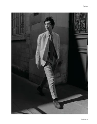 Model Bai walking down a street in a tailored suit and tie for Esquire China editorial RUSH ! TIME OUT