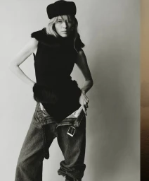 Model Kristine Lindseth wearing a black beret, sleeveless black top and baggy denim jeans for Sixteen Journal.