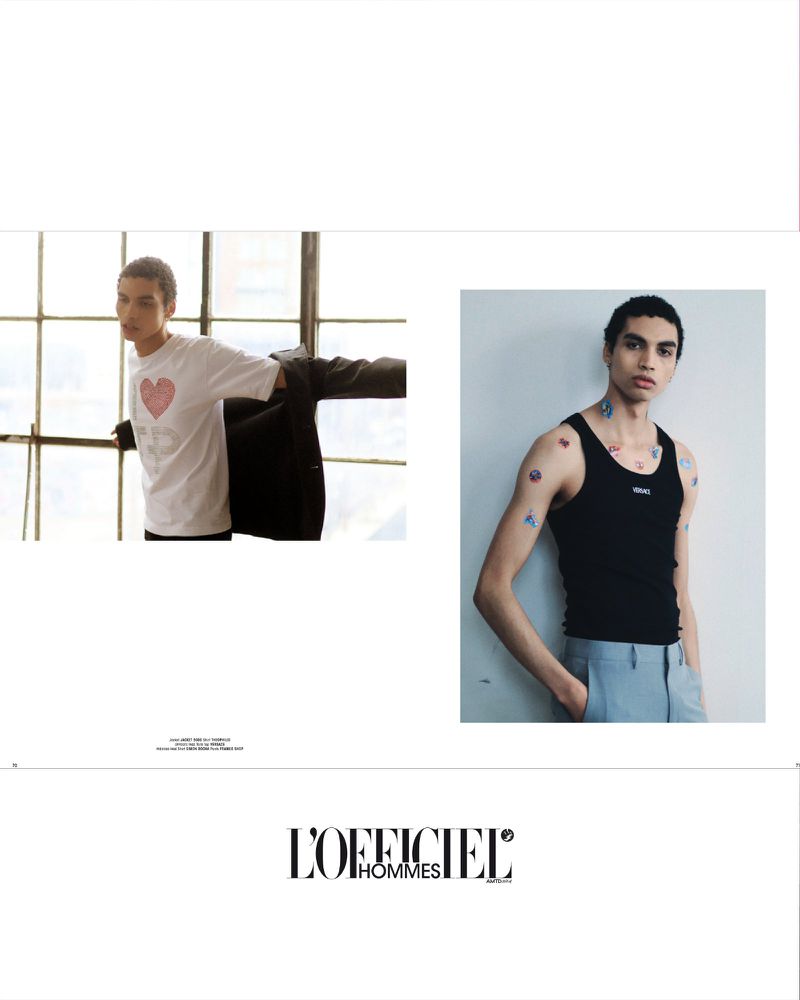 Fashion editorial shot featuring two young male models in a studio with one by a window and the other posing against a white wall.
