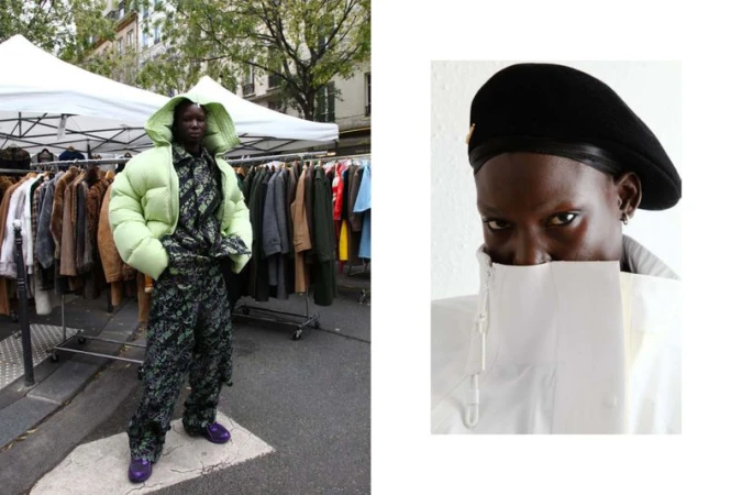 A model showcases an oversized light green puffer jacket and patterned pants, standing outdoors with clothes racks in the background.