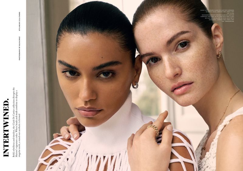 Close-up of two women in a studio setting, showcasing jewellery from the Clash De Cartier collection, with a focus on beauty and fashion.