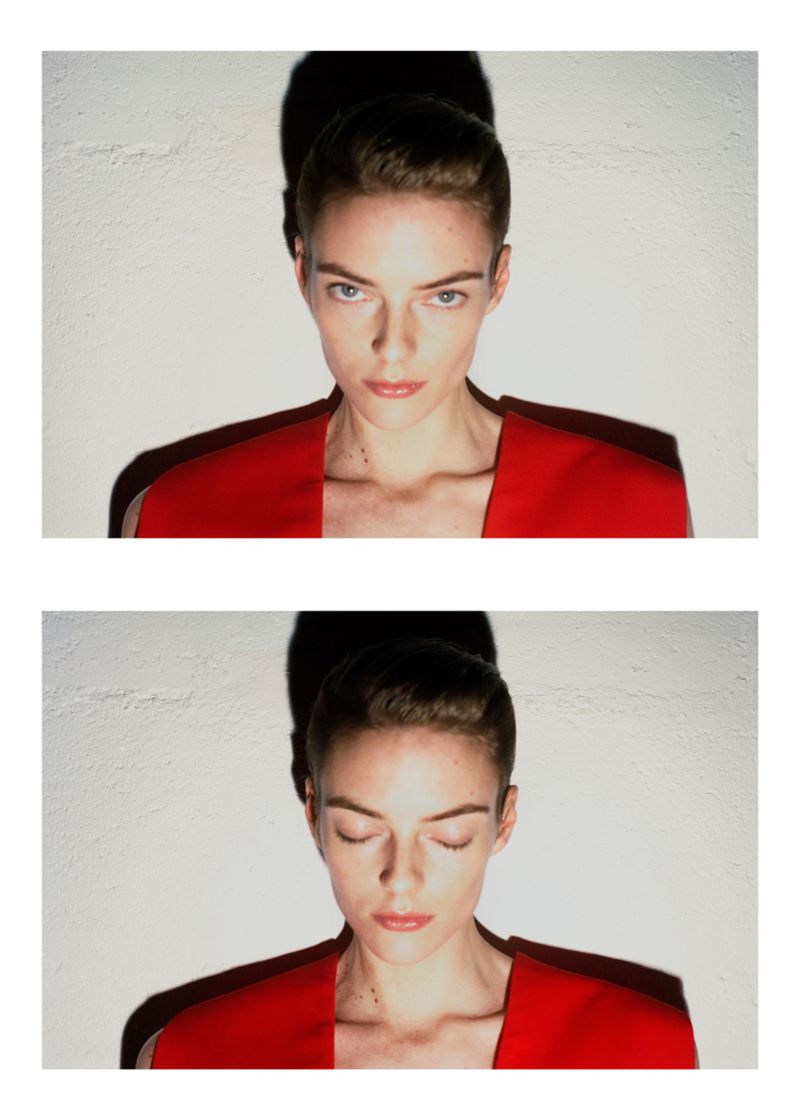 Model Beauïse Genç in a red top with a dark shadow cast on the textured wall behind, for Exhibition Magazine Ti Amo.