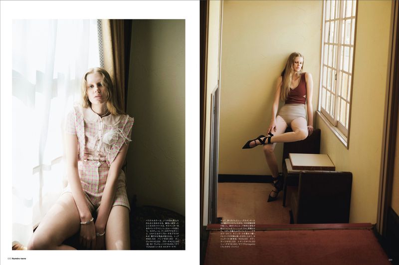 Two fashion photos in a magazine: A woman in a pink outfit poses near a window; another sits on chairs in shorts and a tank top.