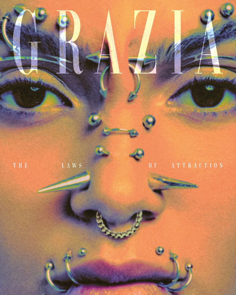 Close-up of a person's face with multiple facial piercings including rings, studs and spikes with 'Grazia' magazine cover text.