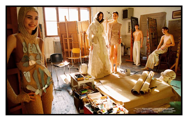 Group of young adult models posing in a light-filled art studio. Canvases, art supplies, paint, and sculpture create a creative, editorial fashion image.