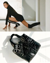 Model in a black turtleneck outfit posing on the floor alongside a quilted black leather handbag with silver charms.
