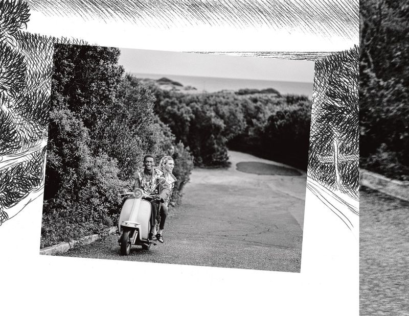 Black and white photo of a smiling man and woman riding a scooter down a road lined with trees, creating a travel or lifestyle image.