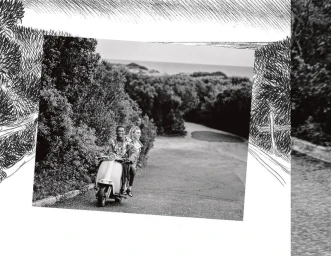Black and white editorial image of two models riding a motor scooter down an outdoor path flanked by trees for Hermes.