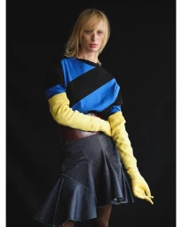 Model Lili Sumner wearing a striped top with yellow sleeves and a skirt for Talia Byre Spring 2025 shot by Esther Theaker