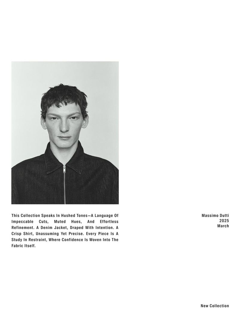 Headshot of a young adult male model in a denim jacket, against a plain background. The photograph is in black and white with muted hues.