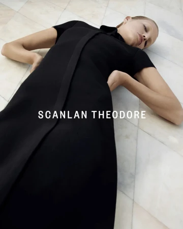 Model Daphne Groeneveld in a black dress lying on a tiled marble floor for Scanlan Theodore Winter 23 campaign photographed by Robbie Fimmano.