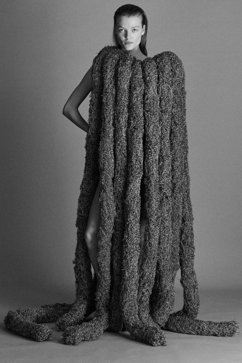 Model Ella Dalton wearing a heavy textured fringe garment in a studio shoot for Ponte F/W 25 by Mark Kean