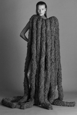Model Ella Dalton wearing a heavy textured fringe garment in a studio shoot for Ponte F/W 25 by Mark Kean