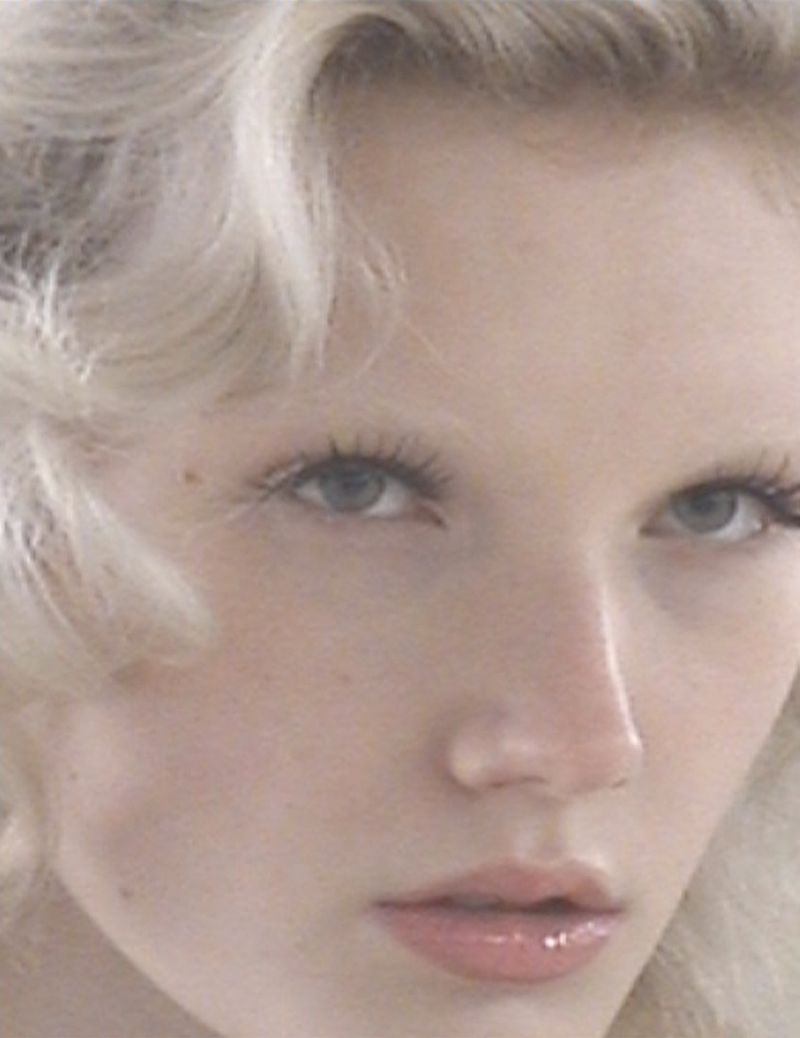 Close-up portrait of a model with blonde hair and light blue eyes for ALL-IN fall winter 2025 ready-to-wear collection.