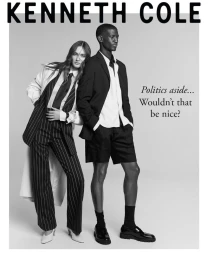 Black and white fashion campaign image featuring two models posing against a plain backdrop with bold typography.